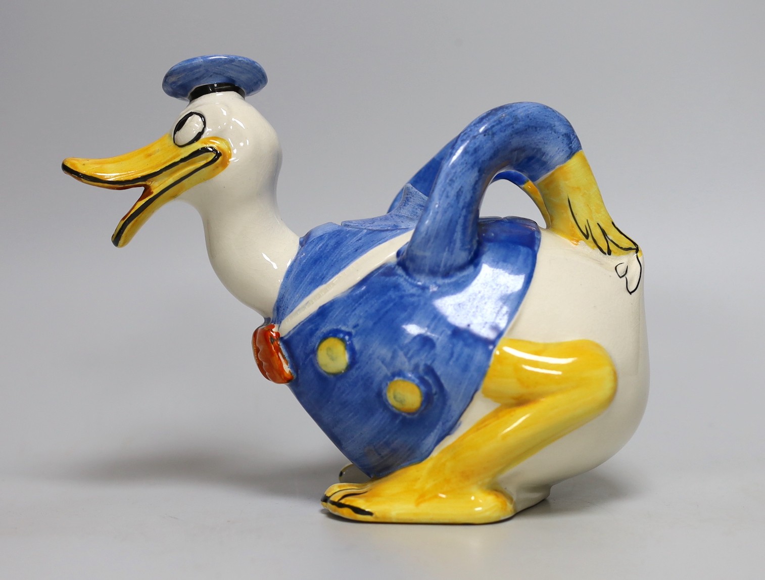 A Wade Heath Donald Duck teapot and cover, 22cms wide x 16.5cms high